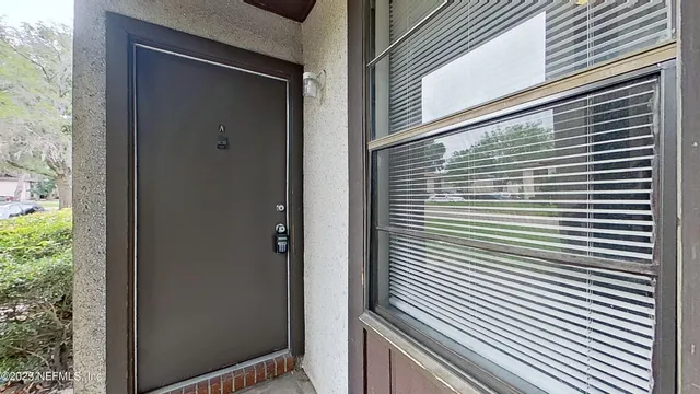 a view of a balcony and a garage