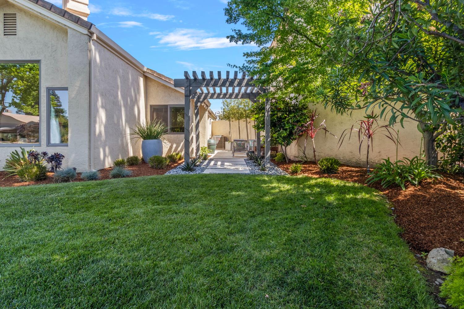 1013 Copper Lake Court Modesto, CA 95355 - Photo 35 of 66 a view of a house with backyard and porch