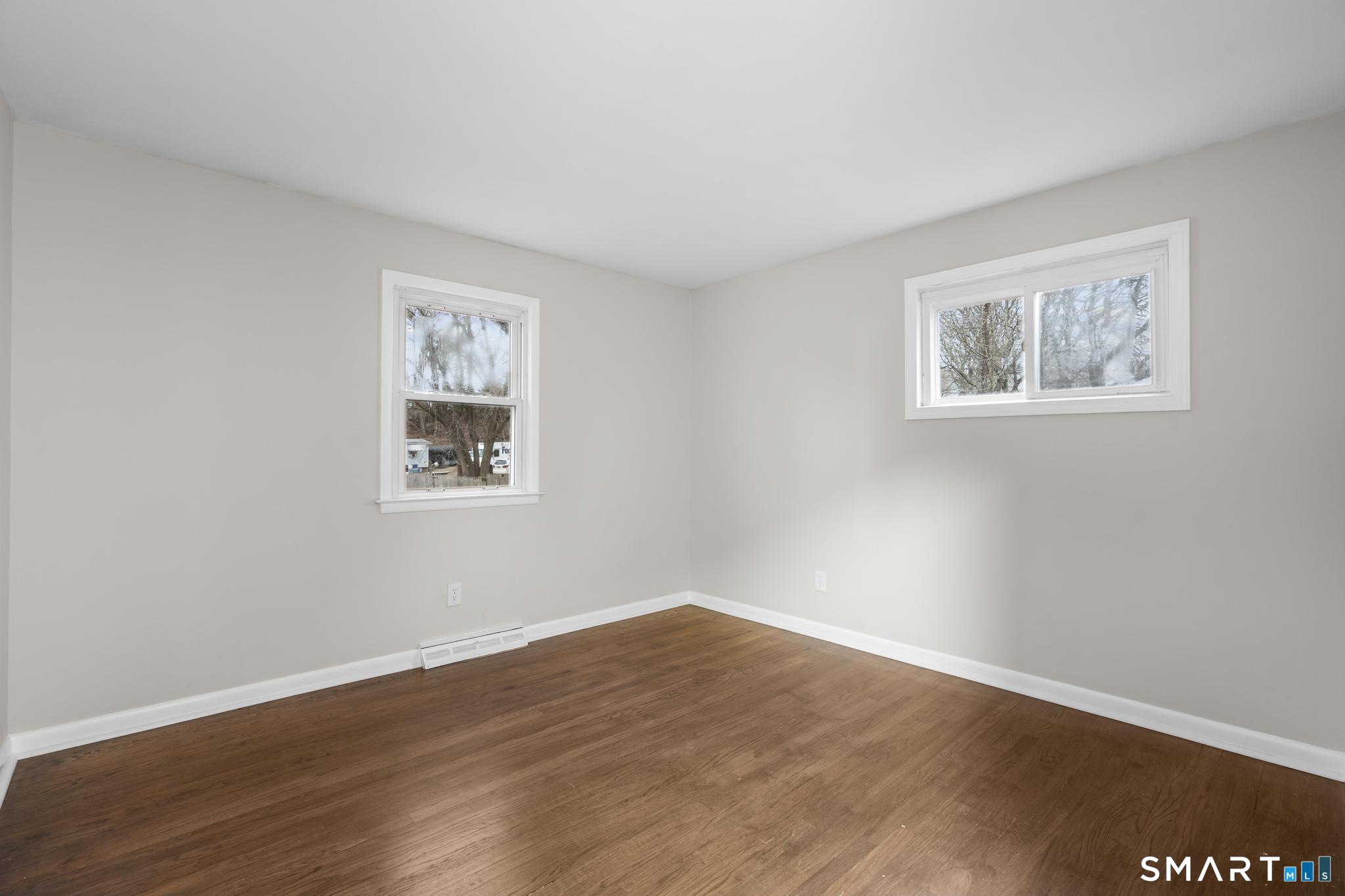 3 Highview Lane New Haven, CT 06513 - Photo 11 of 30 a view of an empty room with wooden floor and window