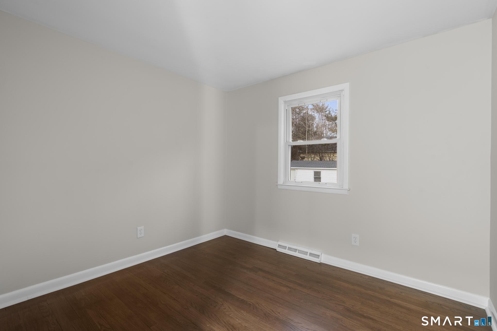 3 Highview Lane New Haven, CT 06513 - Photo 12 of 30 a view of an empty room with wooden floor and a window