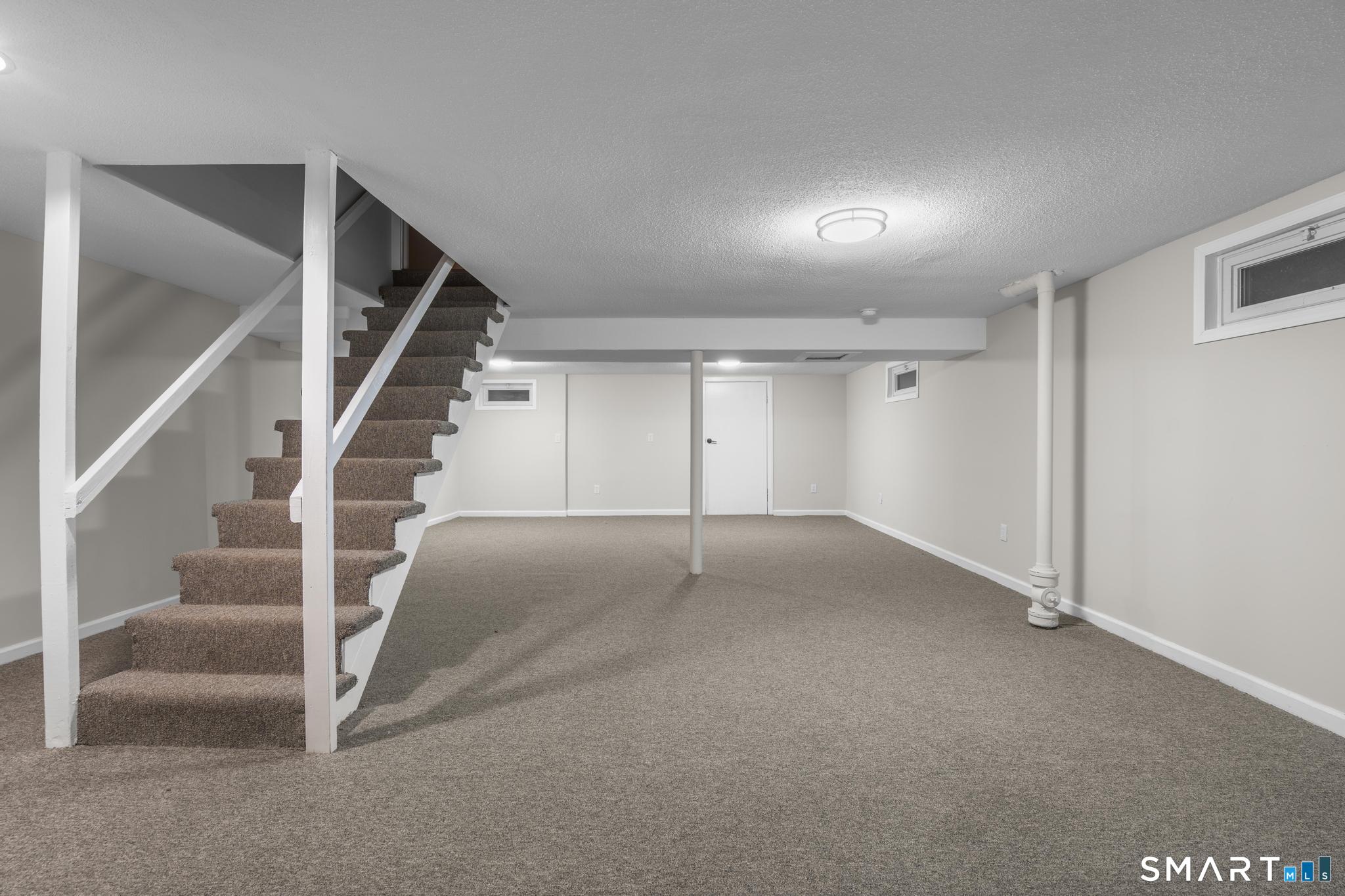 3 Highview Lane New Haven, CT 06513 - Photo 19 of 30 a view of an empty room with stairs
