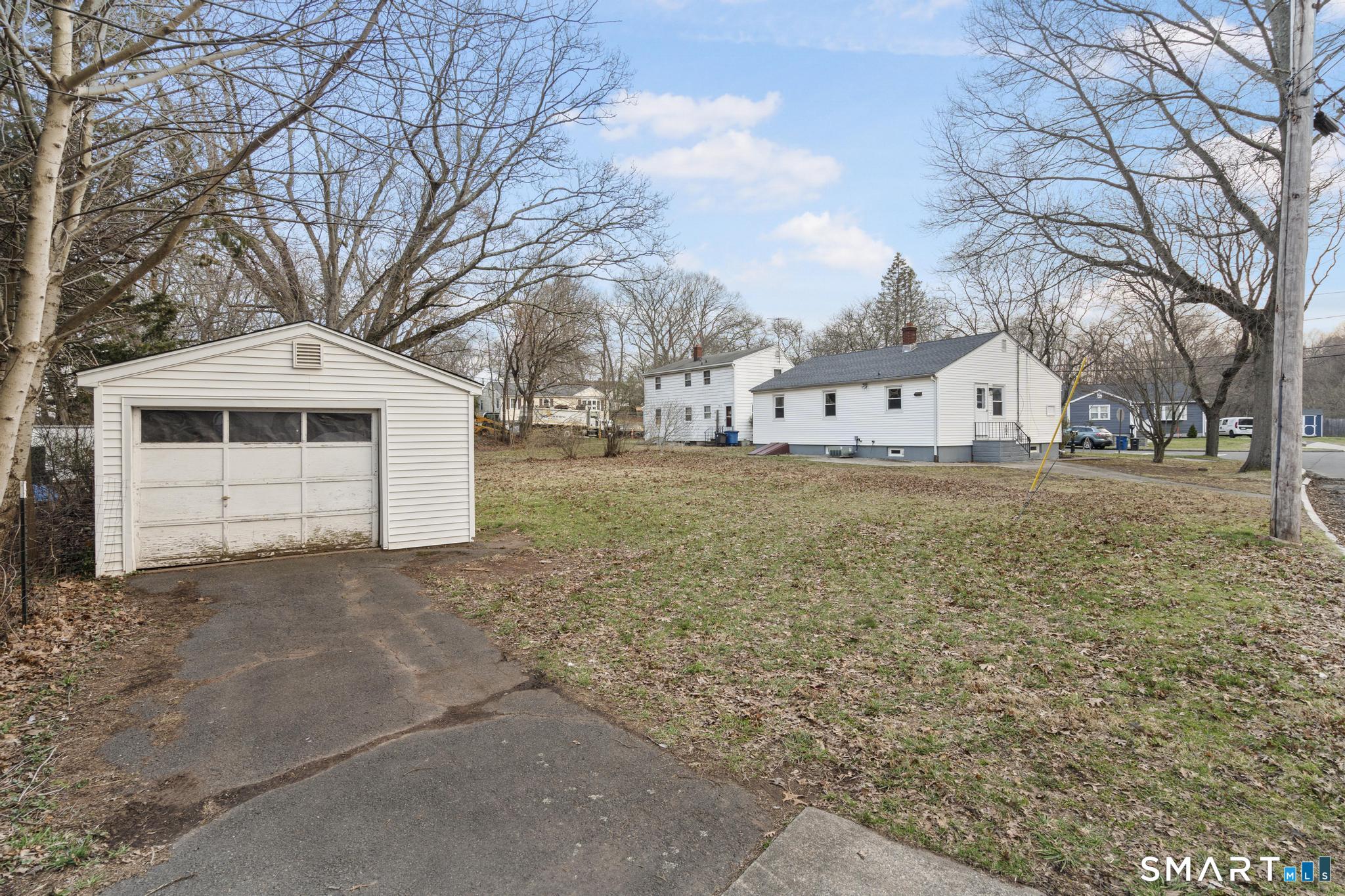 3 Highview Lane New Haven, CT 06513 - Photo 30 of 30 a front view of a house with a yard and garage
