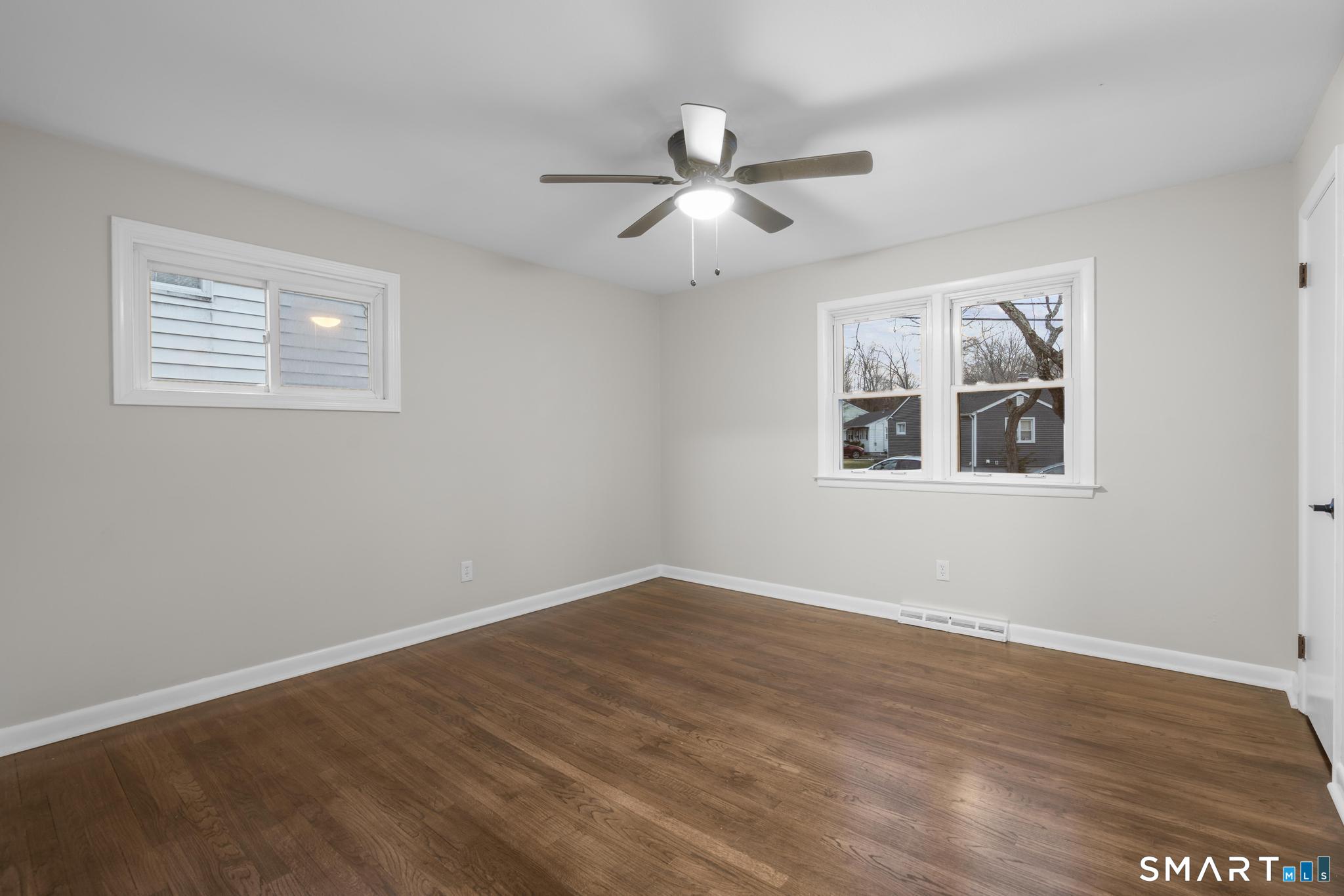 3 Highview Lane New Haven, CT 06513 - Photo 10 of 30 a view of an empty room with wooden floor and a window