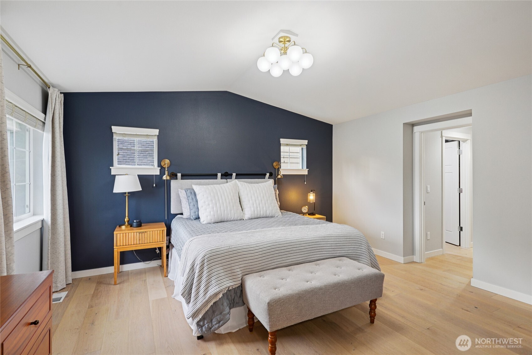 6523 128th Place Southwest Edmonds, WA 98026 - Photo 19 of 35 a bedroom with a bed and a chandelier