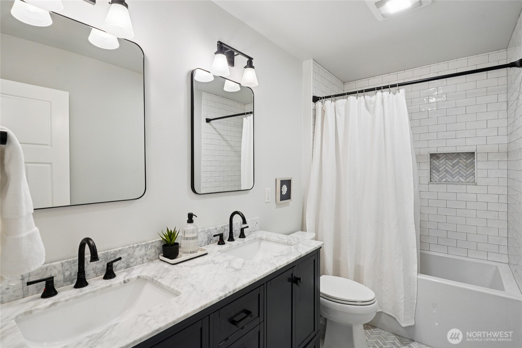 6523 128th Place Southwest Edmonds, WA 98026 - Photo 30 of 35 a bathroom with a double vanity sink toilet and shower