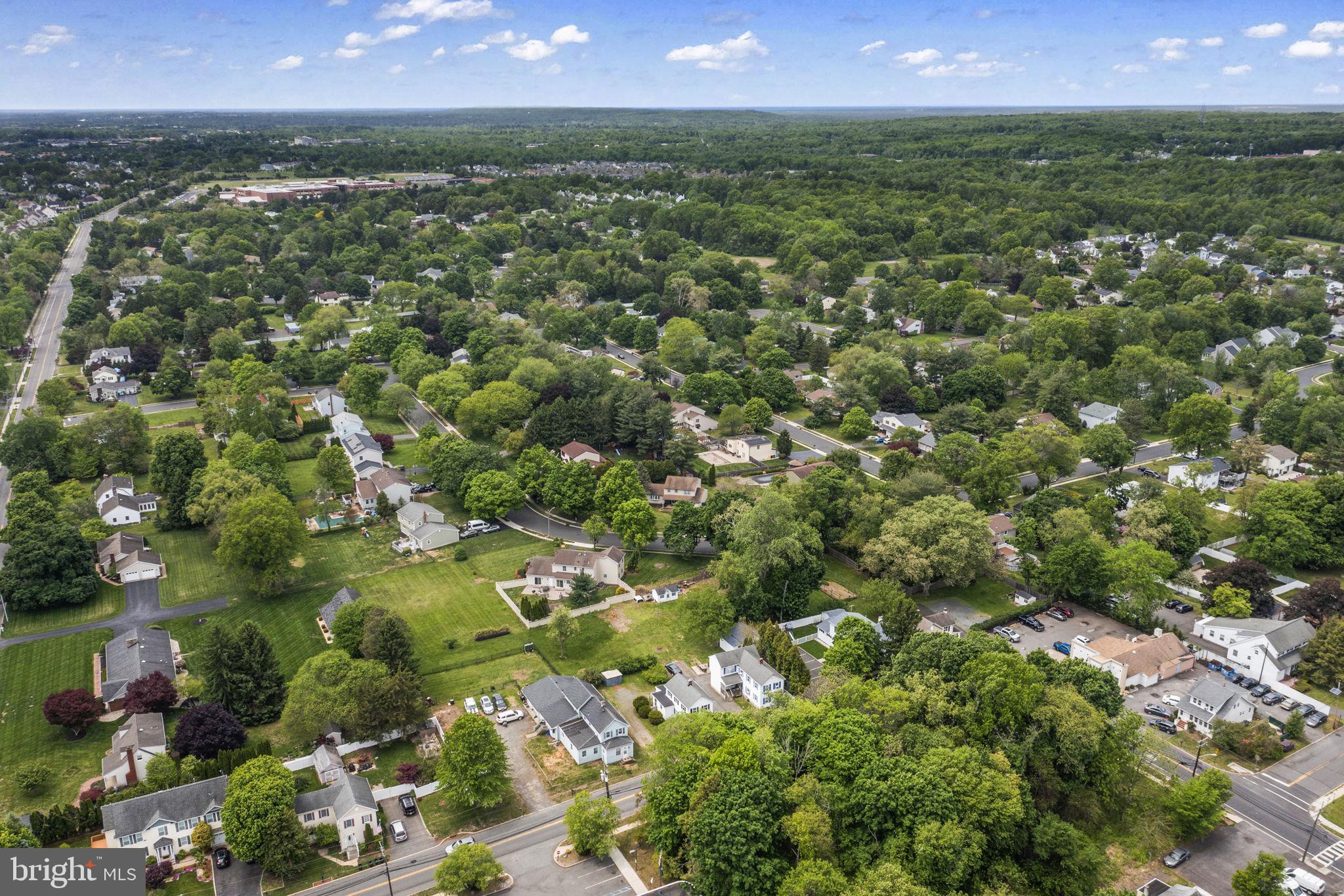 646 Ridge Road Monmouth Junction, NJ 08852 - Photo 36 of 47 Lush suburban landscape under blue skies.