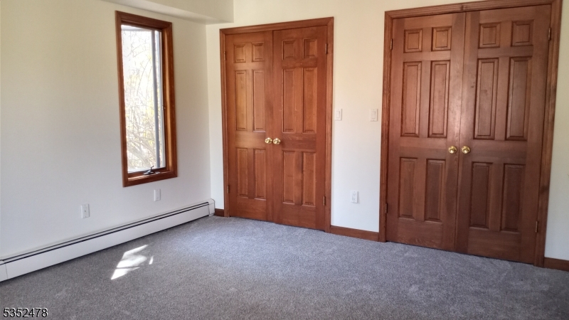 83 Lakeside Drive Vernon, NJ 07461 - Photo 14 of 34 an empty room with windows