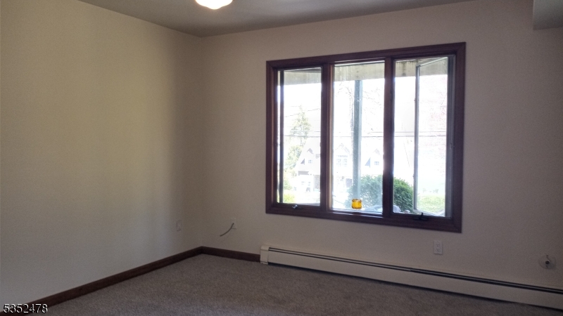 83 Lakeside Drive Vernon, NJ 07461 - Photo 15 of 34 an empty room with windows