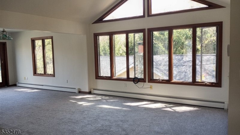 83 Lakeside Drive Vernon, NJ 07461 - Photo 20 of 34 an empty room with a empty space and windows