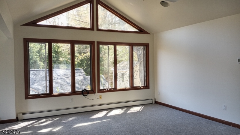 83 Lakeside Drive Vernon, NJ 07461 - Photo 21 of 34 an empty room with large windows