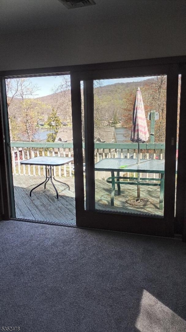 83 Lakeside Drive Vernon, NJ 07461 - Photo 23 of 34 a view of a room with mountain view and wooden floor