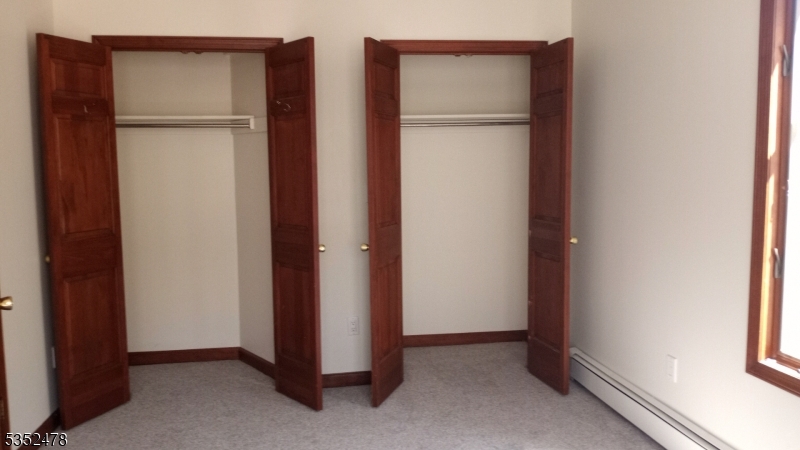 83 Lakeside Drive Vernon, NJ 07461 - Photo 28 of 34 a view of an empty room with closet and a window
