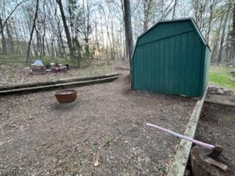 83 Lakeside Drive Vernon, NJ 07461 - Photo 6 of 34 a backyard of a house with barbeque oven