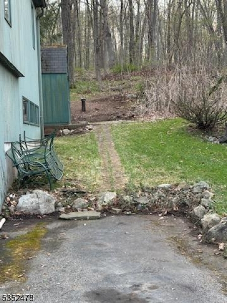 83 Lakeside Drive Vernon, NJ 07461 - Photo 7 of 34 a view of a backyard with large trees