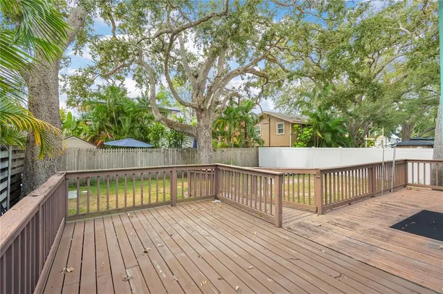 a view of a house with wooden deck