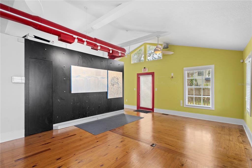 1950 Adams Lane Sarasota, FL 34236 - Photo 3 of 18 a view of an empty room with wooden floor and a window