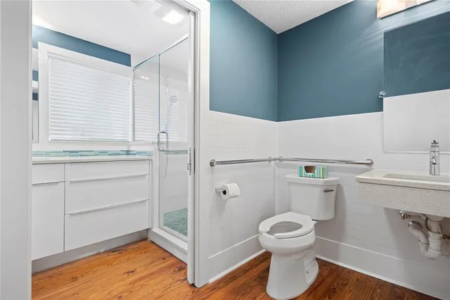 a kitchen with stainless steel appliances a refrigerator and a stove top oven