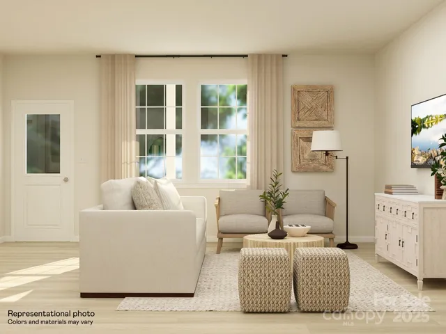 a large white table and chairs in a kitchen next to a window