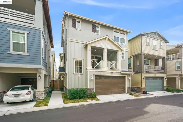 a car parked in front of a white building