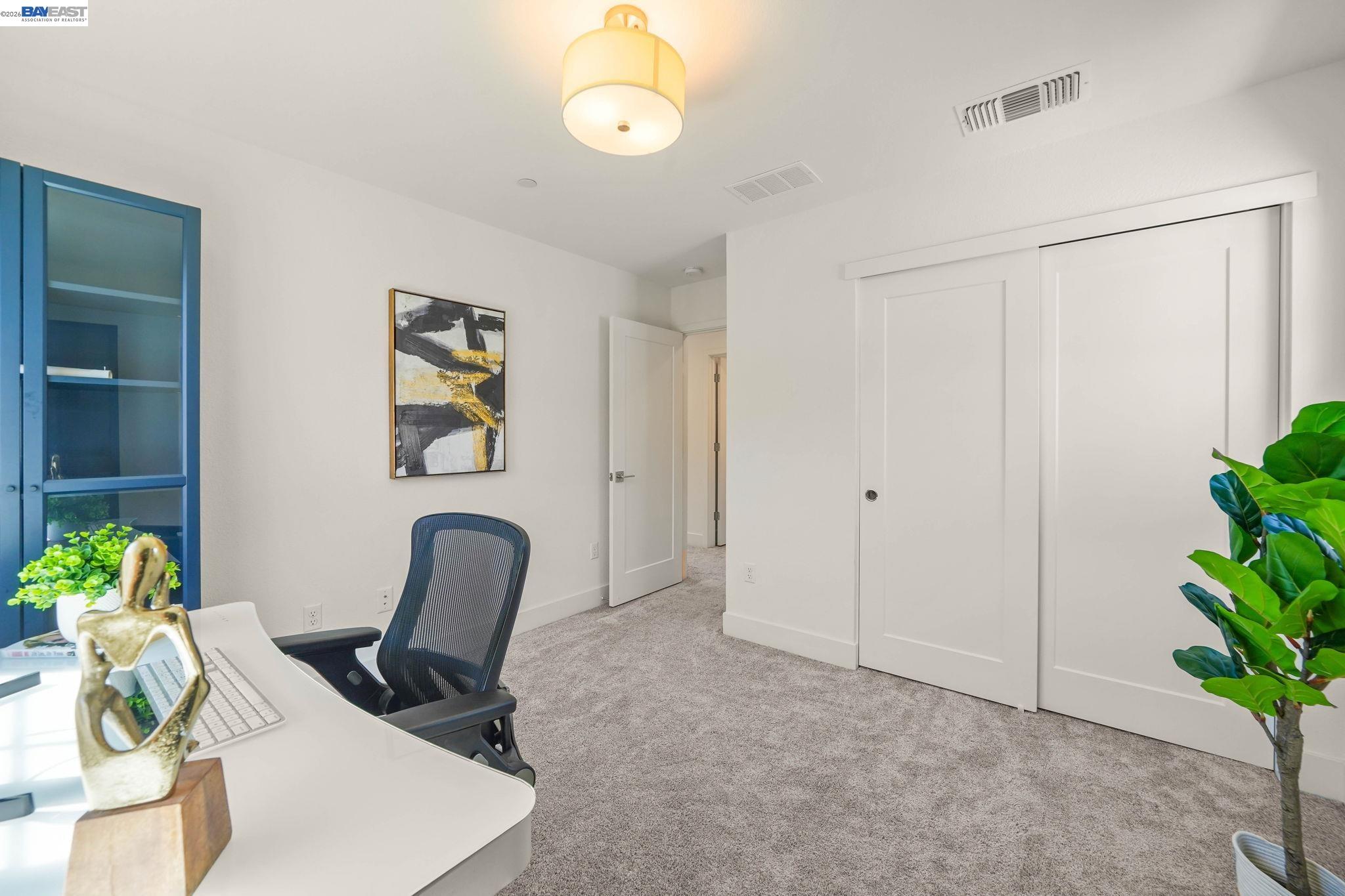 9034 Rudder Way Newark, CA 94560 - Photo 14 of 42 a view of a workspace with furniture and a potted plant