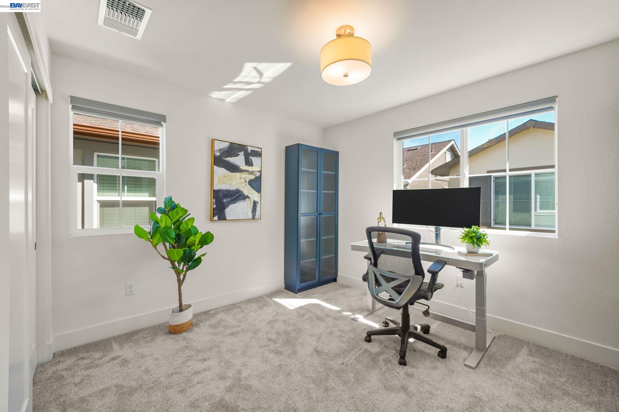 9034 Rudder Way Newark, CA 94560 - Photo 15 of 42 a view of a workspace with furniture and a window
