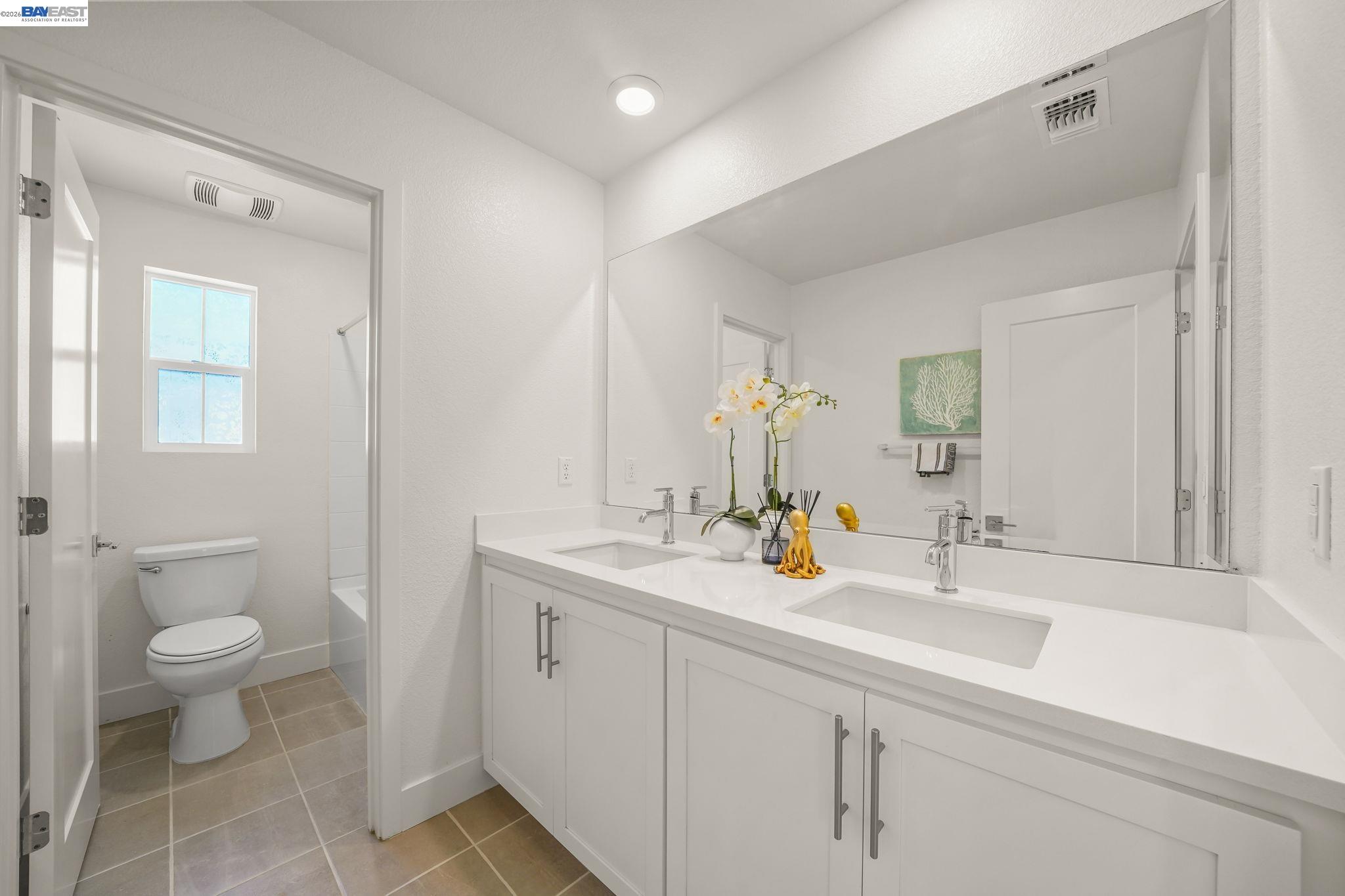 9034 Rudder Way Newark, CA 94560 - Photo 18 of 42 a bathroom with a sink a toilet and a mirror