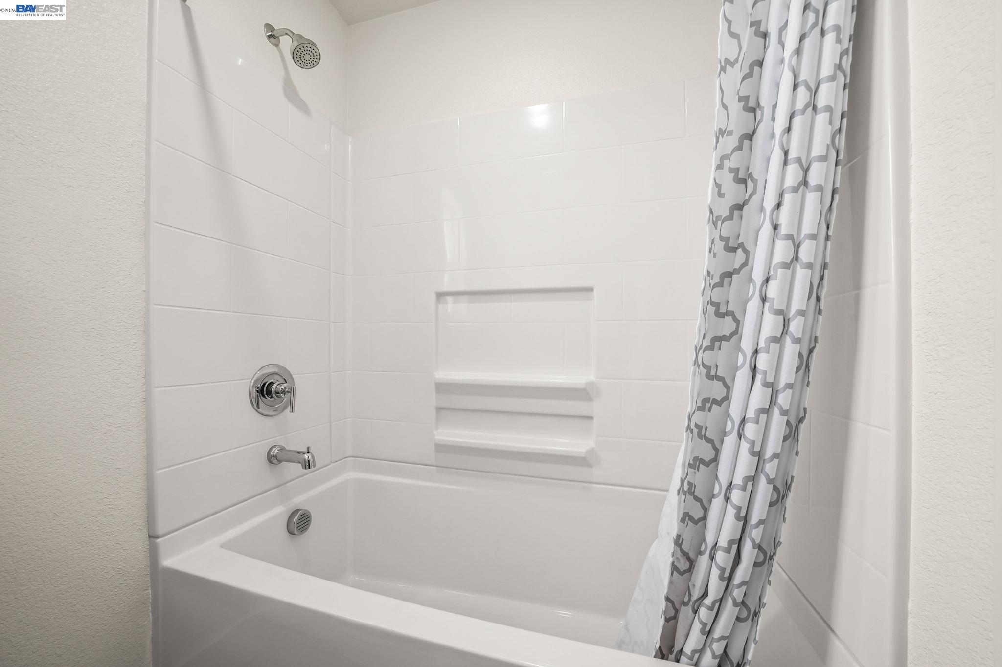 9034 Rudder Way Newark, CA 94560 - Photo 19 of 42 a bathroom with a bathtub and shower