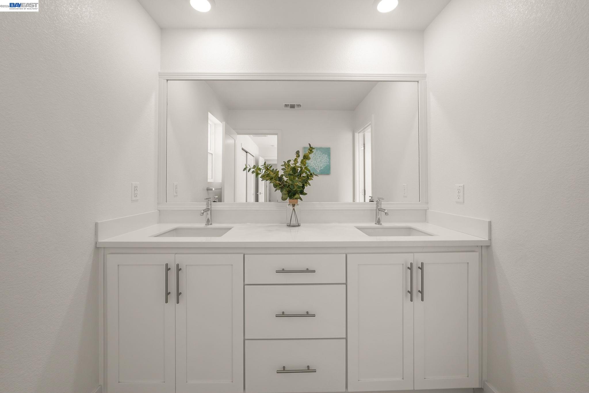 9034 Rudder Way Newark, CA 94560 - Photo 21 of 42 a bathroom with a sink and a mirror