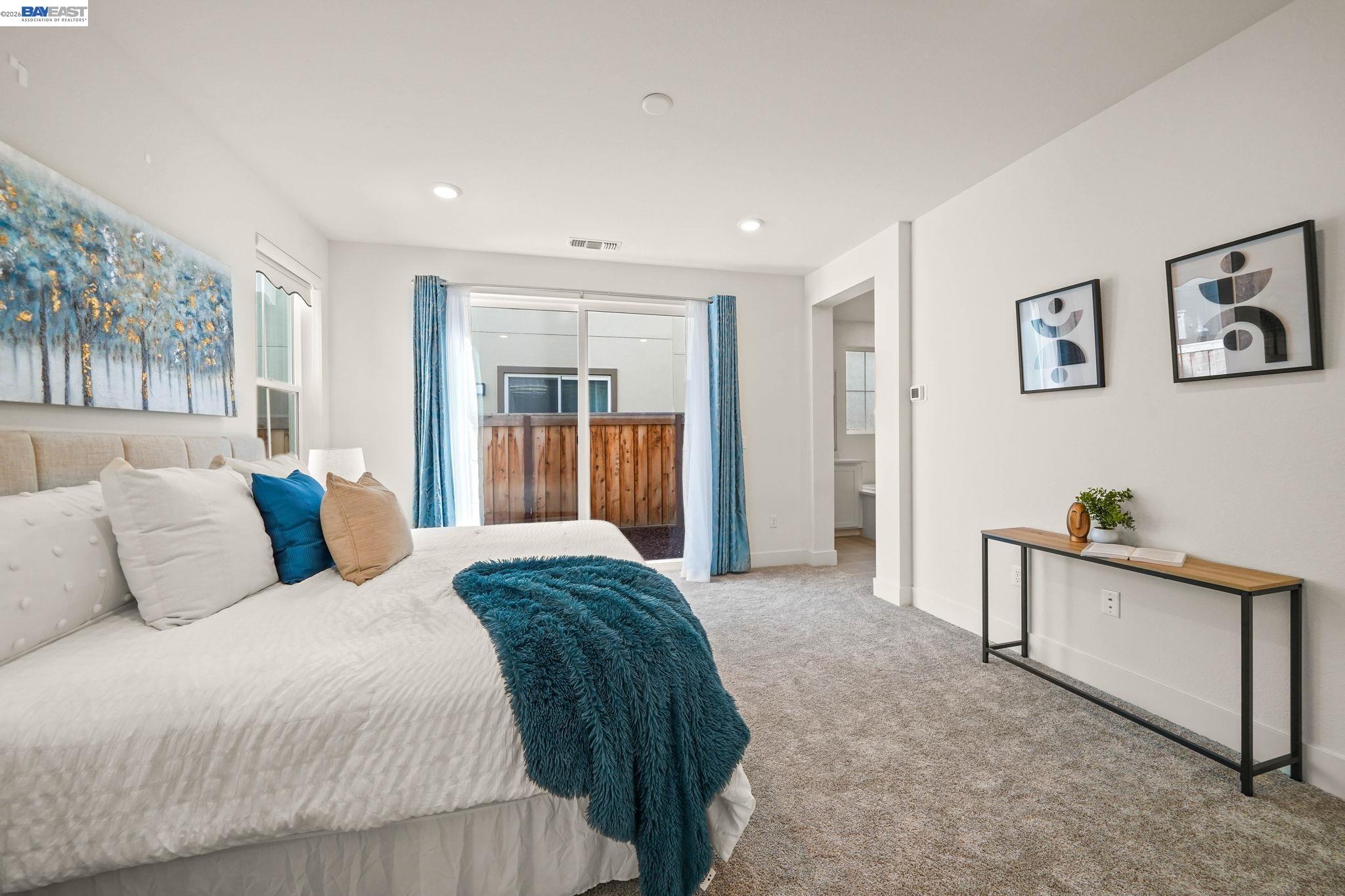 9034 Rudder Way Newark, CA 94560 - Photo 25 of 42 a spacious bedroom with a bed and a desk