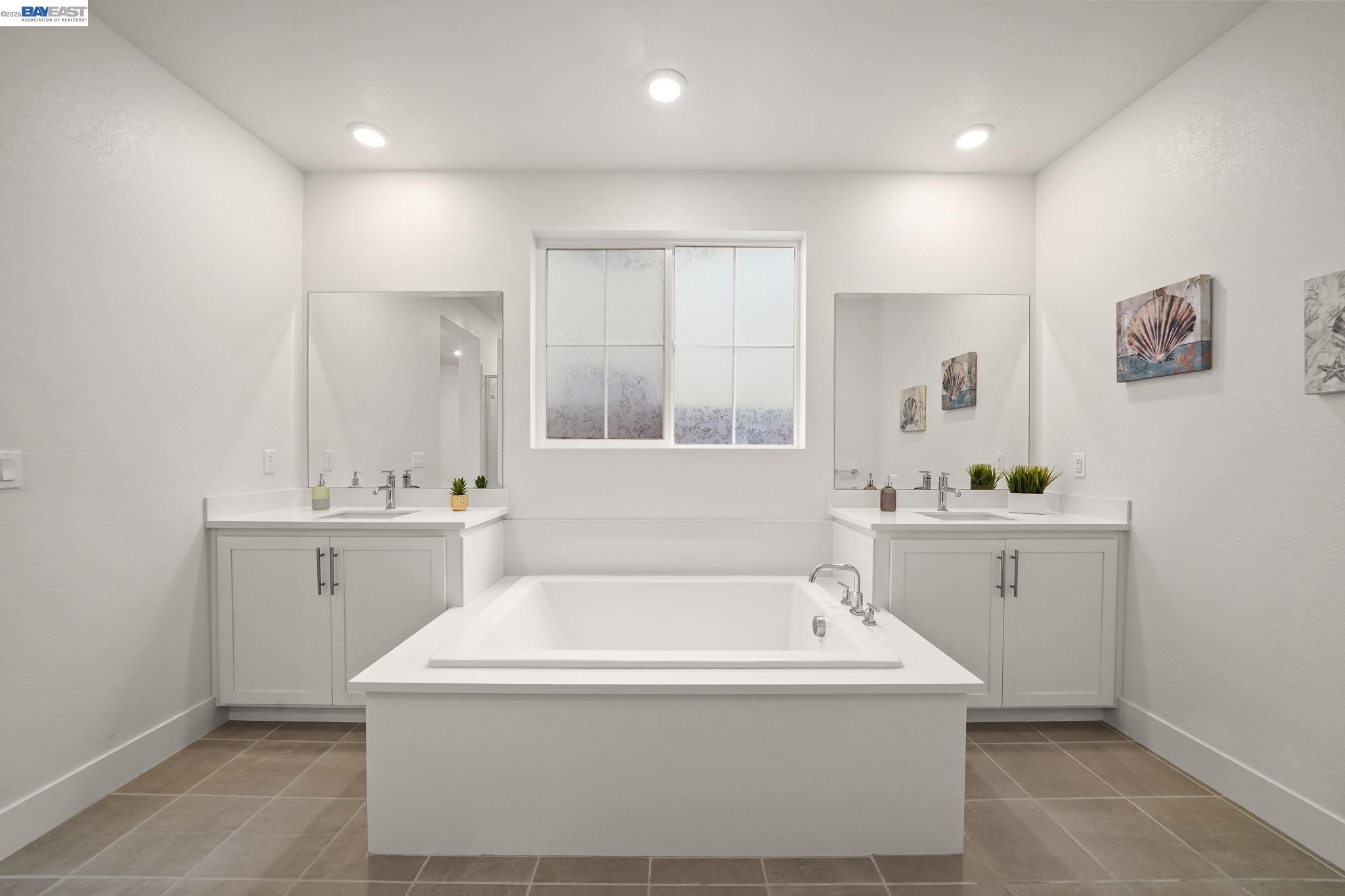 9034 Rudder Way Newark, CA 94560 - Photo 27 of 42 a bathroom with a sink a mirror and a bathtub