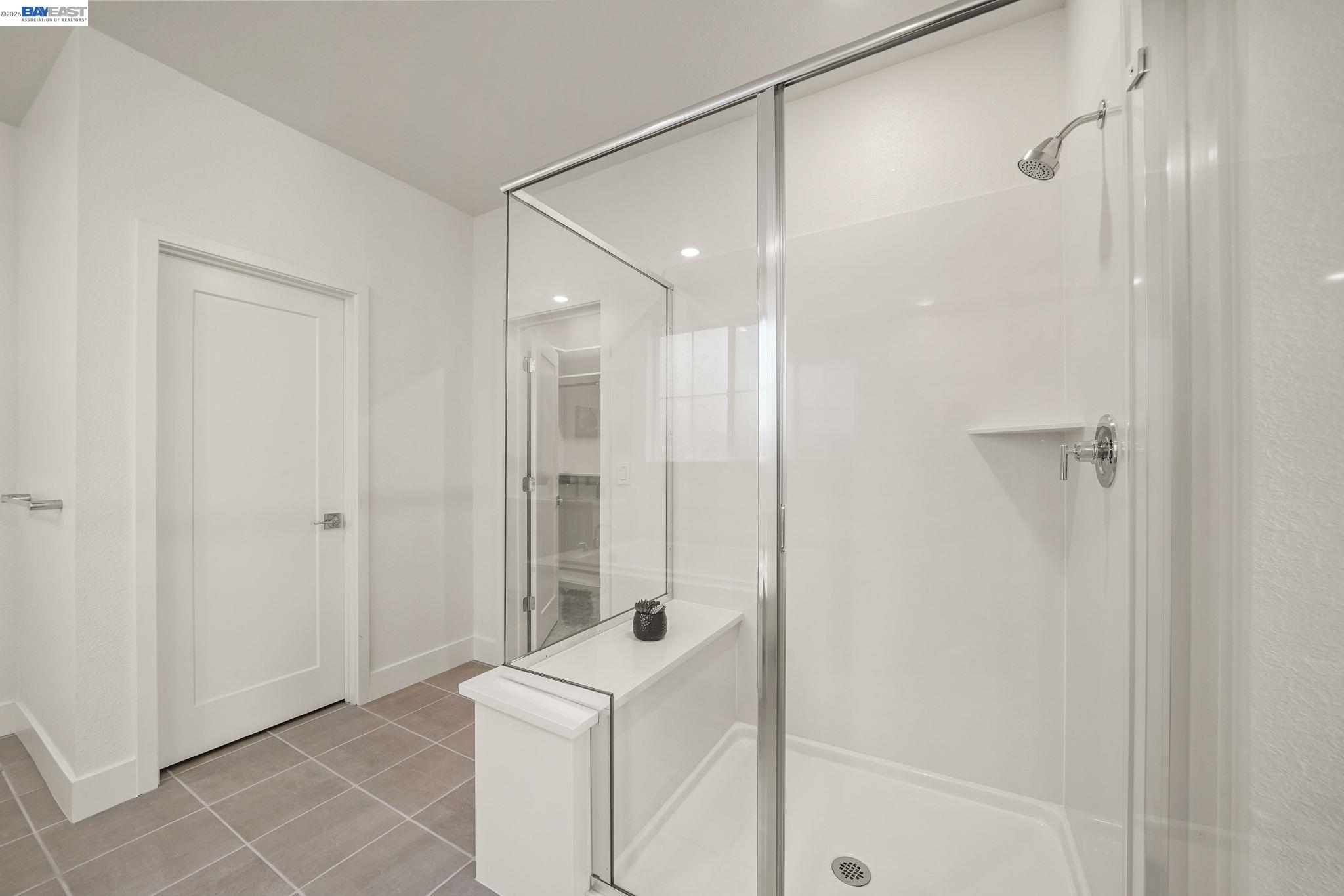 9034 Rudder Way Newark, CA 94560 - Photo 28 of 42 a bathroom with a shower and a glass door