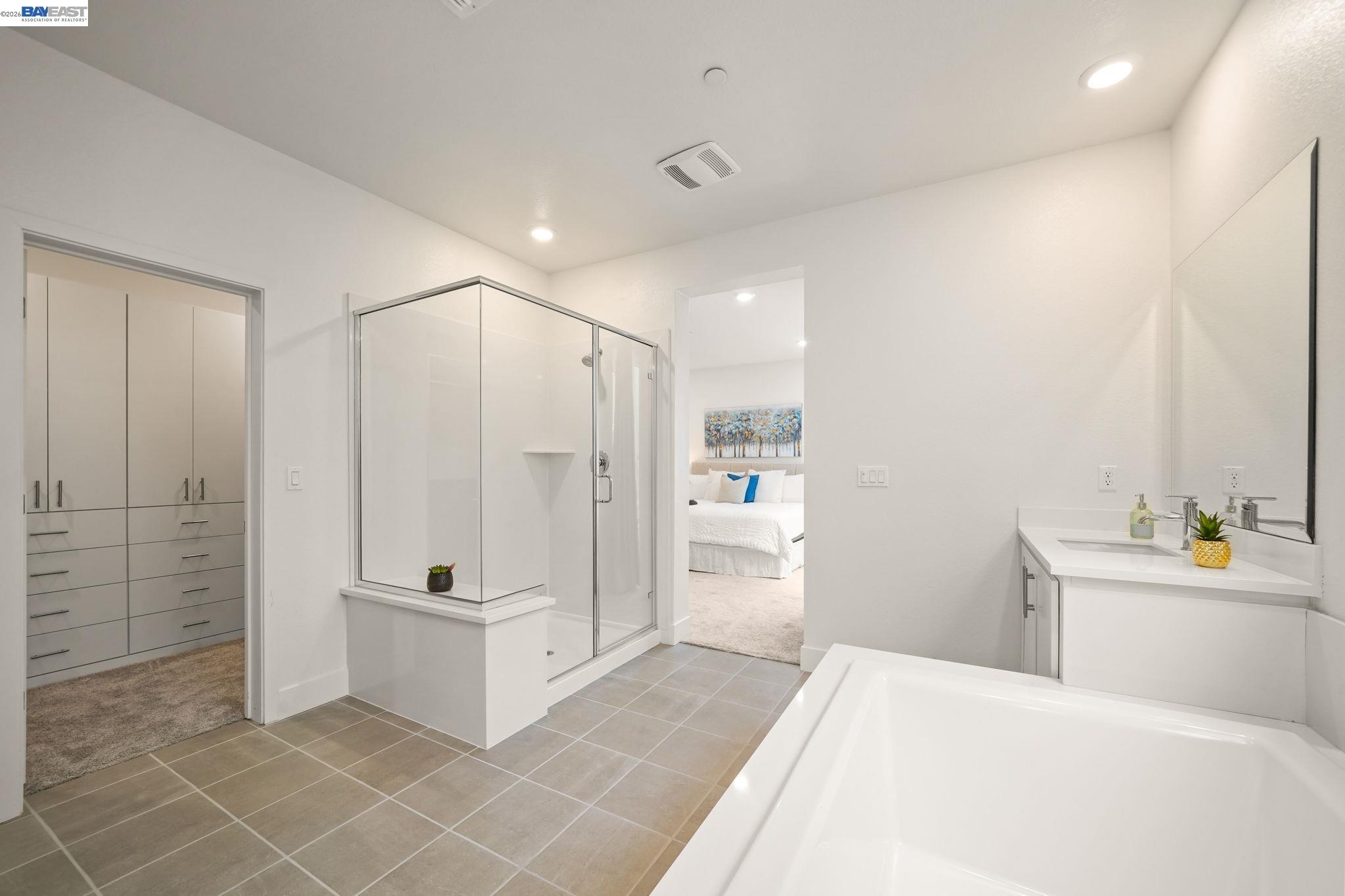 9034 Rudder Way Newark, CA 94560 - Photo 30 of 42 a bathroom with a tub shower a sink and mirror