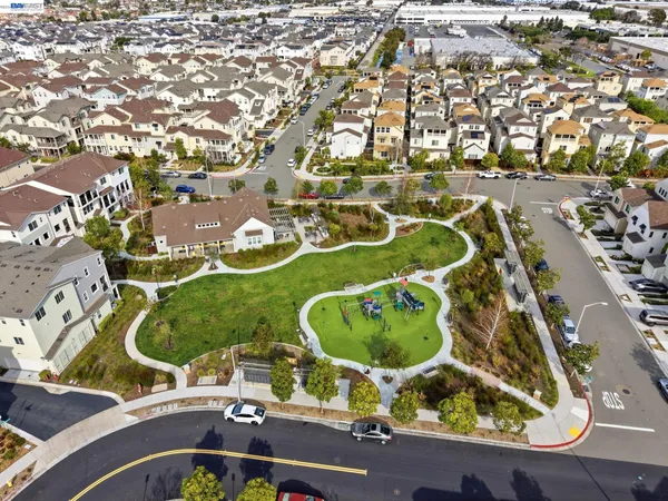 an aerial view of residential house with outdoor space and swimming pool