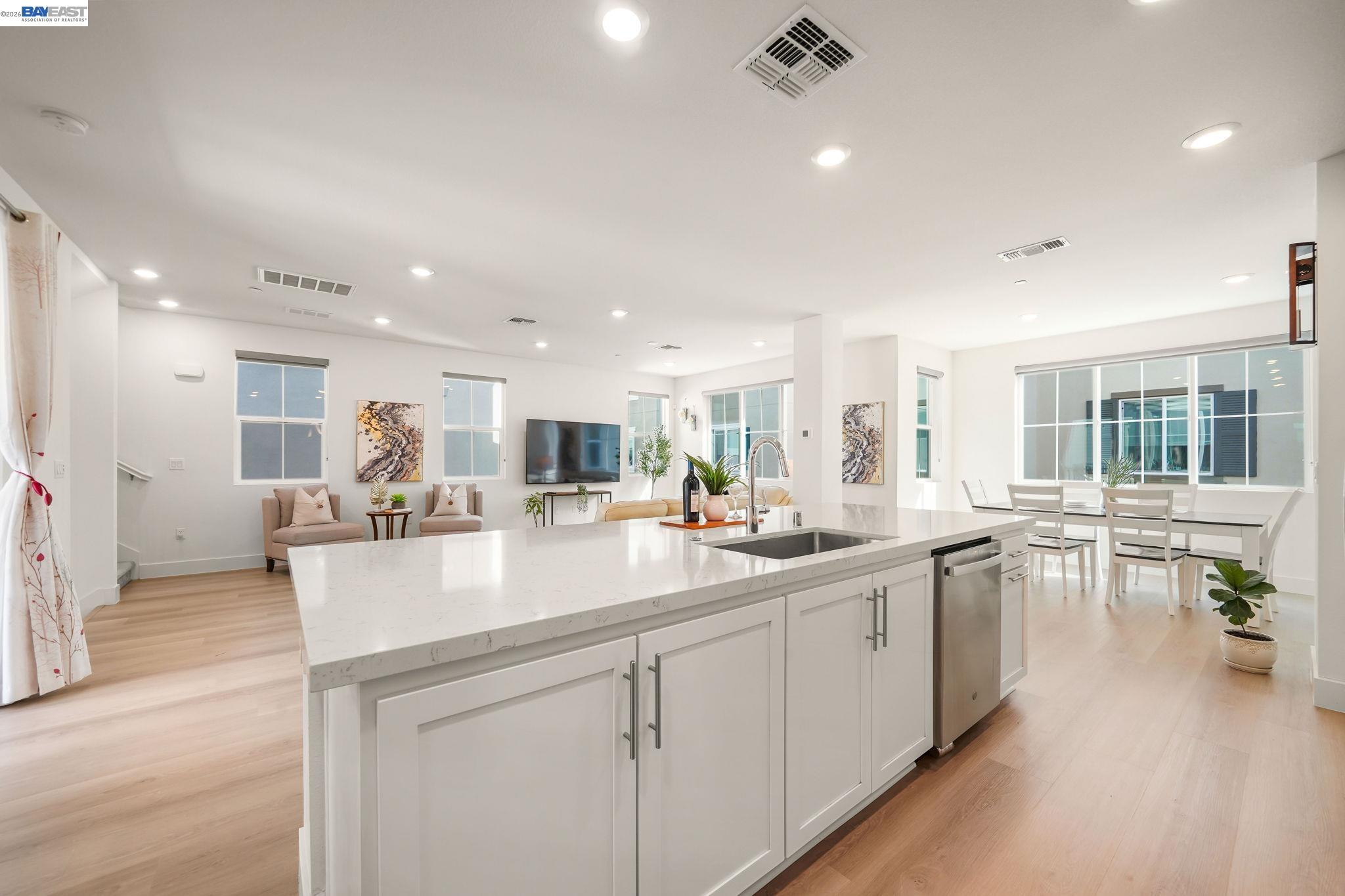 9034 Rudder Way Newark, CA 94560 - Photo 10 of 42 a kitchen with sink attached with living room