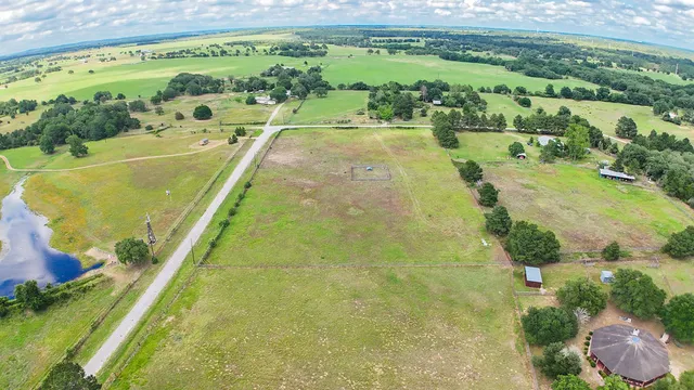 a view of a field with an ocean