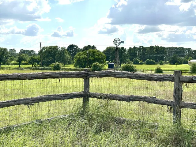 a view of swimming pool with outdoor space and seating