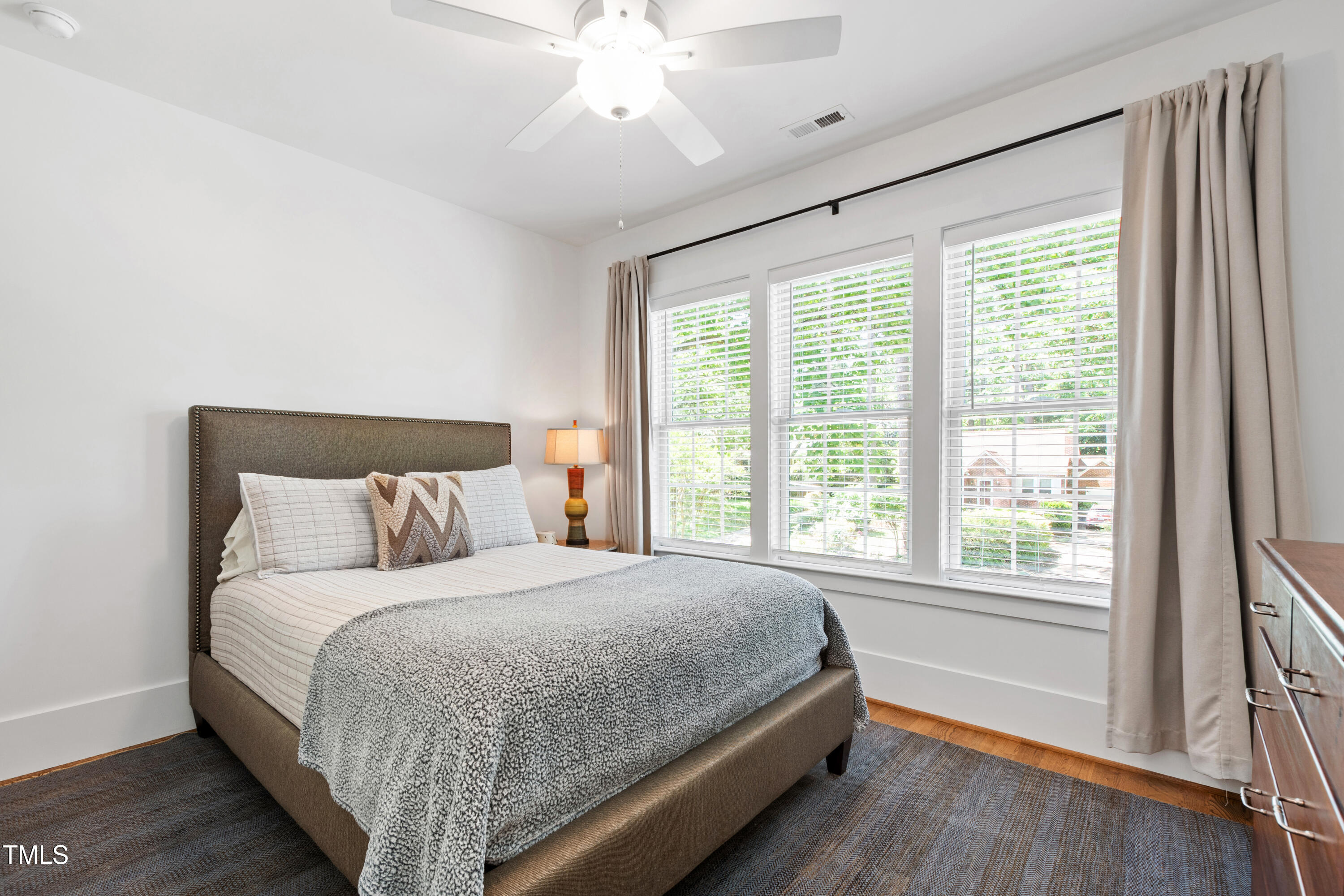 308 Furches Street Raleigh, NC 27607 - Photo 36 of 47 a bedroom with a large bed and a large window
