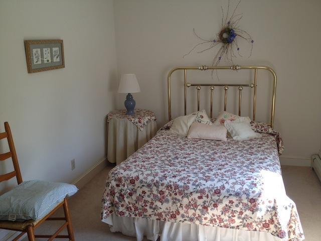 138 Third Avenue Hyannis, MA 02601 - Photo 12 of 27 a large bed sitting in a bedroom next to a window