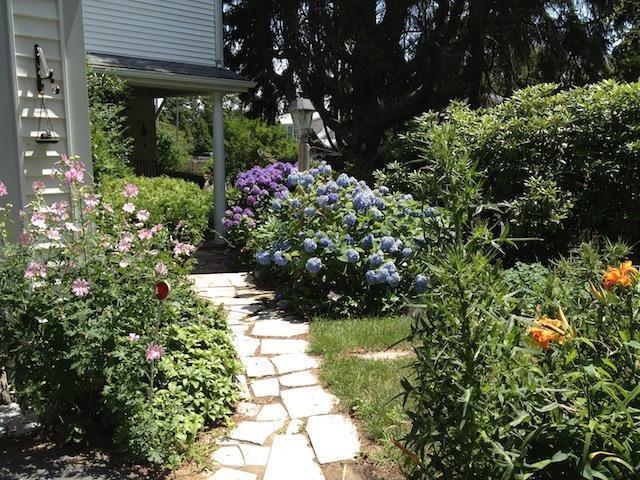 138 Third Avenue Hyannis, MA 02601 - Photo 3 of 27 a view of a garden with flowers