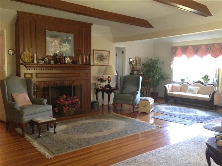 138 Third Avenue Hyannis, MA 02601 - Photo 4 of 27 a living room with furniture and a fireplace