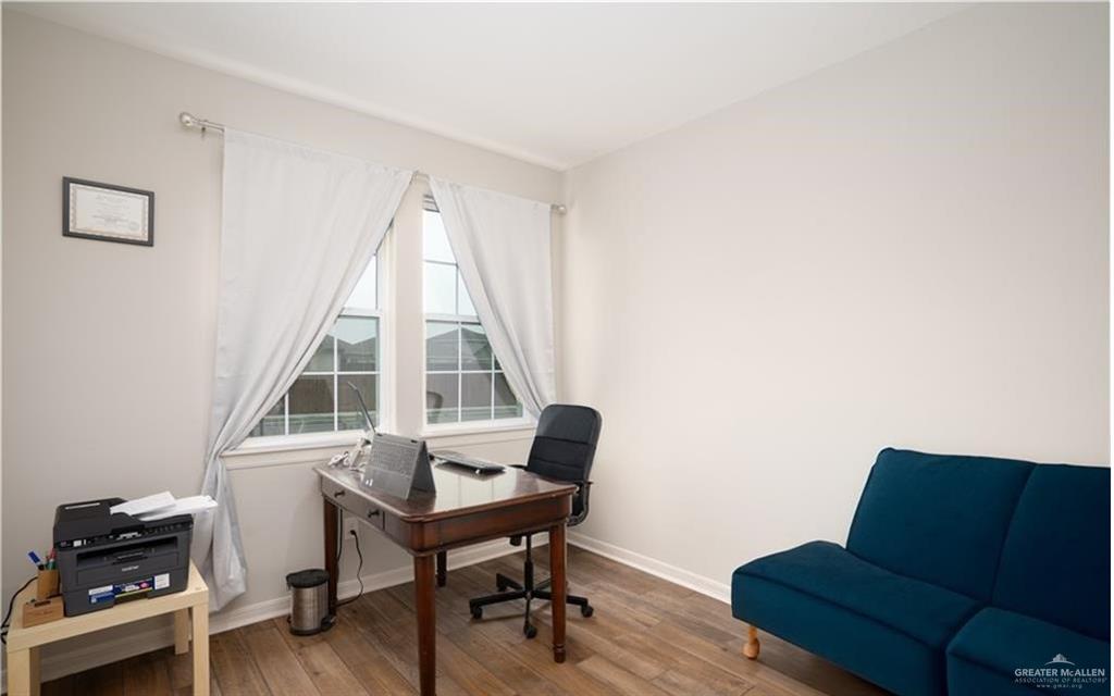 14117 Boykin Creek Road McAllen, TX 78504 - Photo 11 of 19 a view of a workspace with furniture and a window