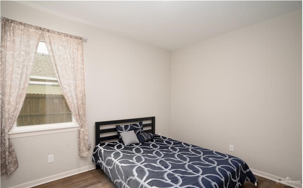 14117 Boykin Creek Road McAllen, TX 78504 - Photo 15 of 19 a bedroom with a bed and a window