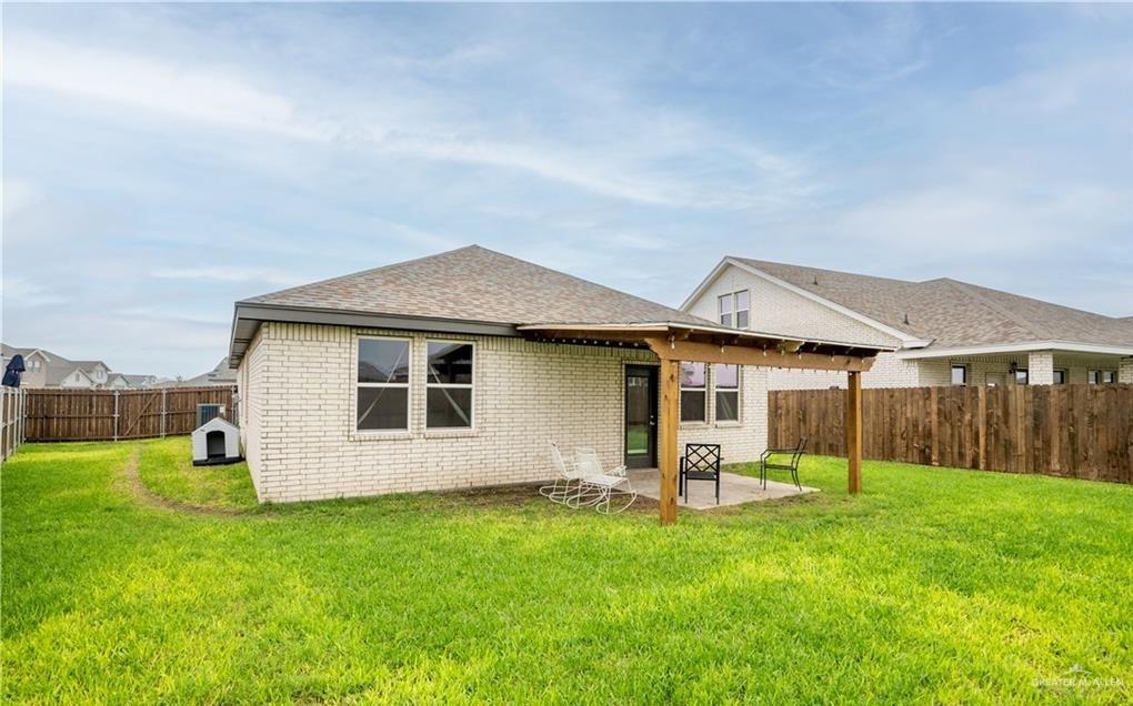 14117 Boykin Creek Road McAllen, TX 78504 - Photo 17 of 19 a backyard of a house with table and chairs