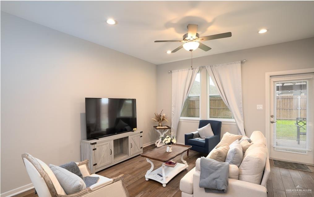 14117 Boykin Creek Road McAllen, TX 78504 - Photo 8 of 19 a living room with furniture and a flat screen tv