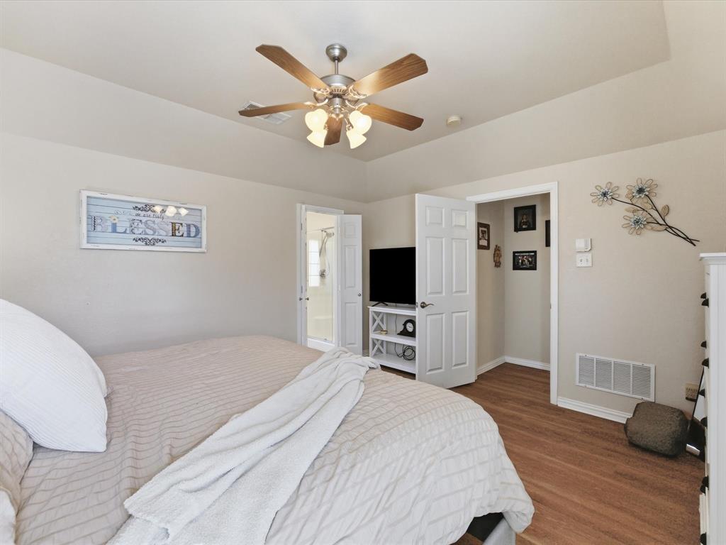 10000 Fireside Lane Forney, TX 75126 - Photo 29 of 40 Master Bedroom featuring ceiling fan, wood finished floors, and connected bathroom