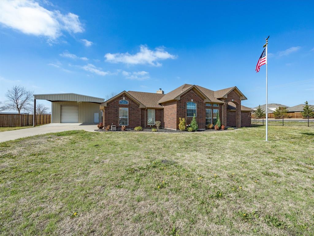 10000 Fireside Lane Forney, TX 75126 - Photo 3 of 40 Single story home with brick siding, a garage, a chimney, and concrete driveway