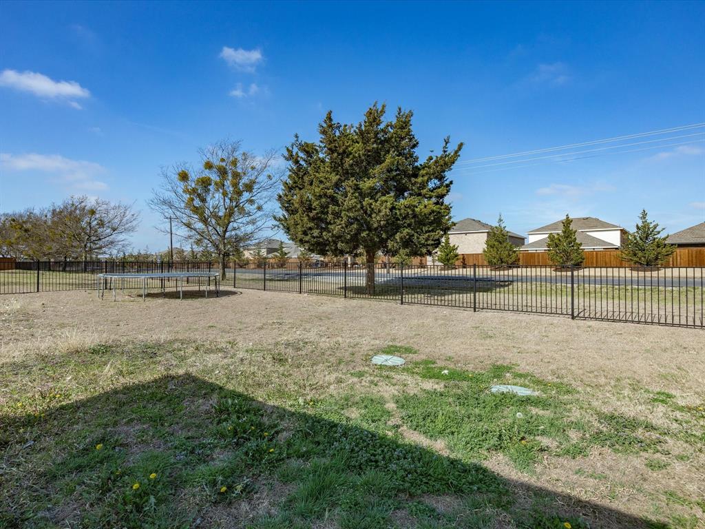 10000 Fireside Lane Forney, TX 75126 - Photo 34 of 40 Fenced backyard featuring a trampoline