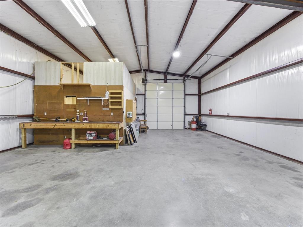 10000 Fireside Lane Forney, TX 75126 - Photo 37 of 40 Detached shop featuring a workshop area and metal wall