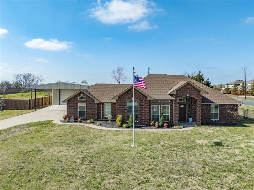 10000 Fireside Lane Forney, TX 75126 - Photo 4 of 40 Ranch-style house with roof with shingles, brick siding, and concrete driveway