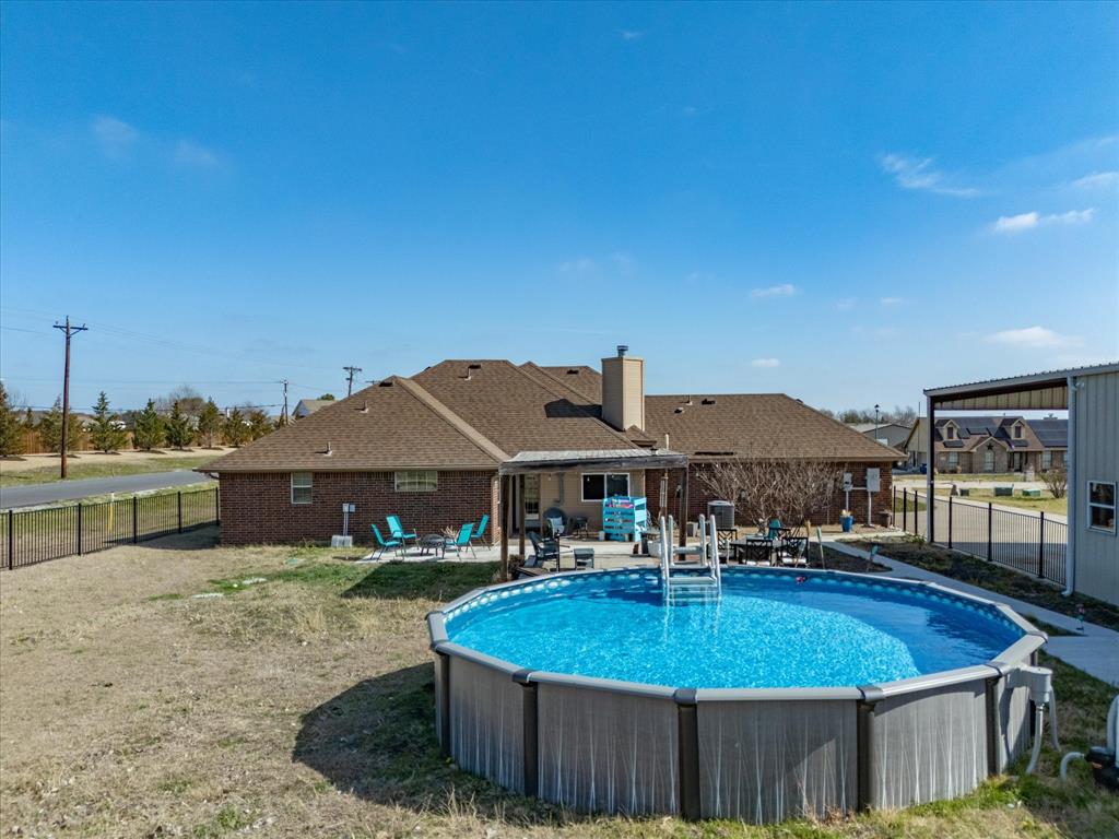 10000 Fireside Lane Forney, TX 75126 - Photo 8 of 40 View of pool featuring patio surround and a fenced backyard